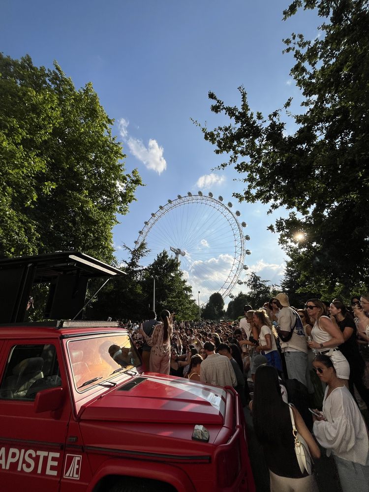 The red G-Class stage in front of a crowd with the London Eye behind